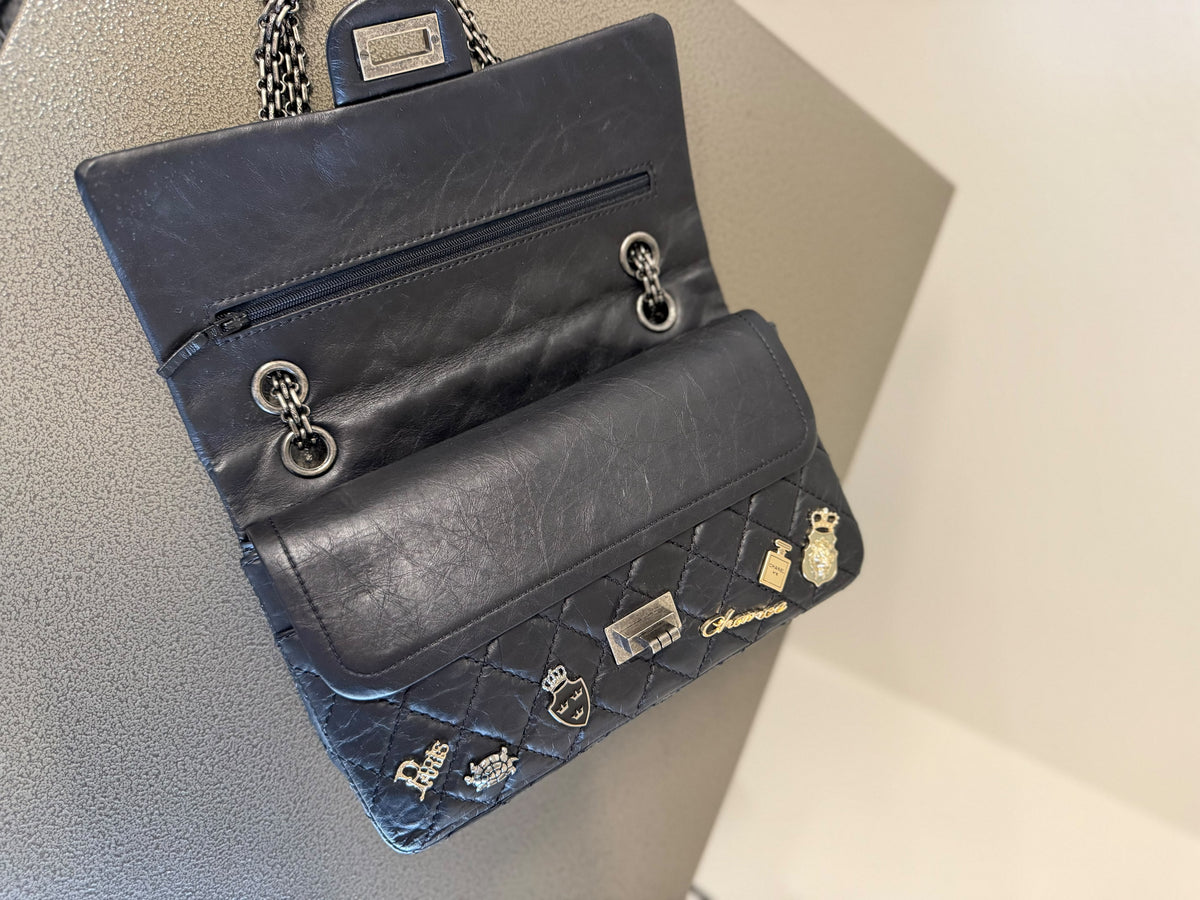 Chanel Black Quilted Charm Flap Bag
